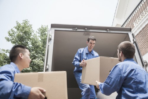Loading belongings into a removals vehicle for a local home move