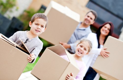 House removals crew handling furniture in a Bullscross property