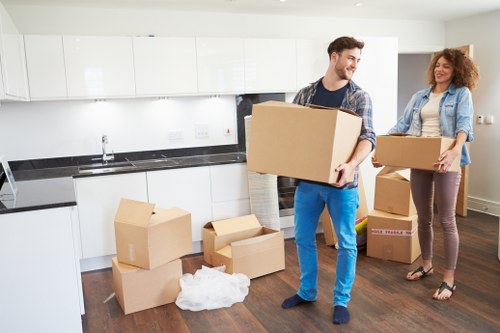 Local movers handling furniture and boxes with care
