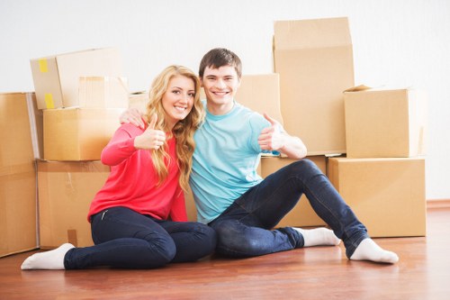 Moving team handling furniture in a Bullscross street