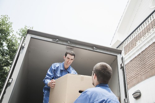 Team using safe lifting techniques during a man with van Bullscross service
